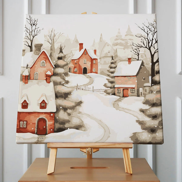 Snow-covered village with cozy red houses and winding pathways
