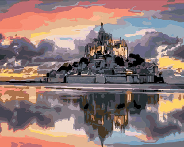 Majestic castle reflecting on water with a colorful sunset sky