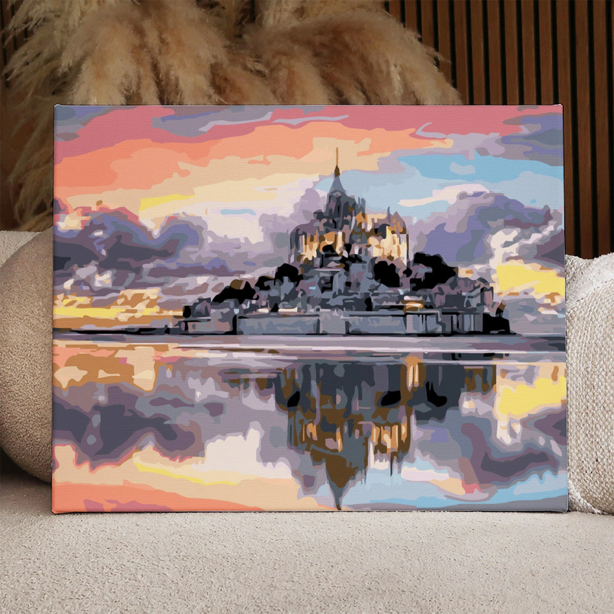 Majestic castle reflecting on water with a colorful sunset sky