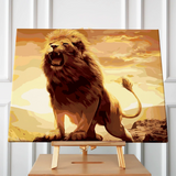 Roaring lion standing on a rock with golden sunset painting
