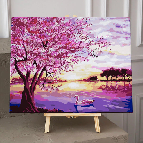 Pink blossom tree by lake with swan and sunset painting