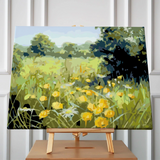 Painting of a sunlit meadow with yellow wildflowers and green trees