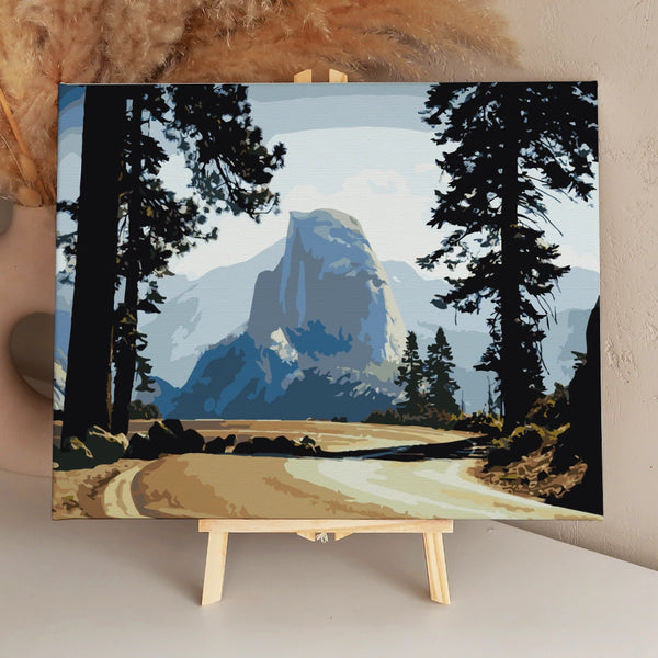 Painting of Yosemite’s Half Dome framed by tall pine trees