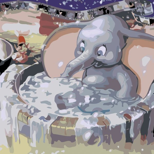 Joyful baby elephant splashing in a water tub at carnival
