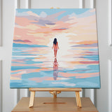 Woman walking on water towards the horizon under pastel sunset