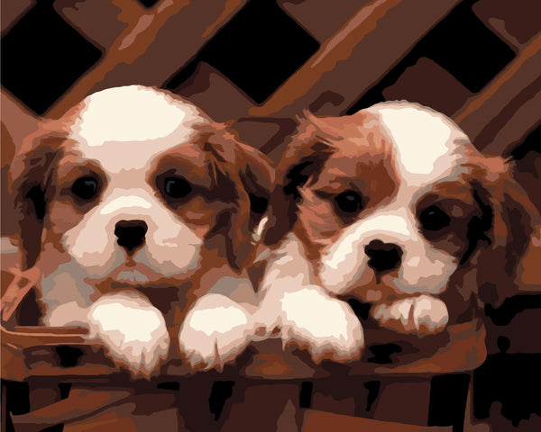 Painting of two Cavalier King Charles Spaniel puppies in a basket