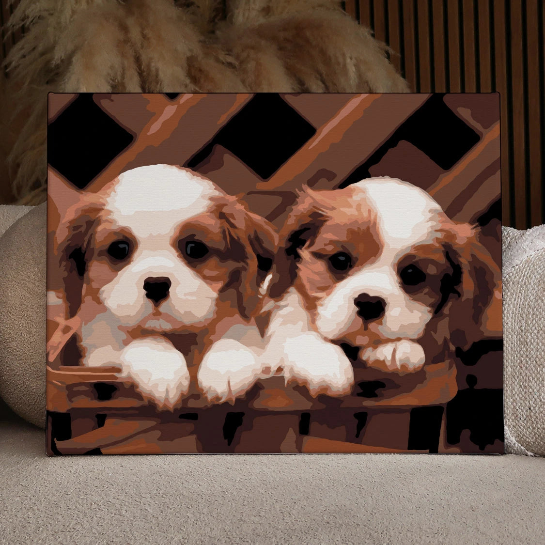 Painting of two Cavalier King Charles Spaniel puppies in a basket