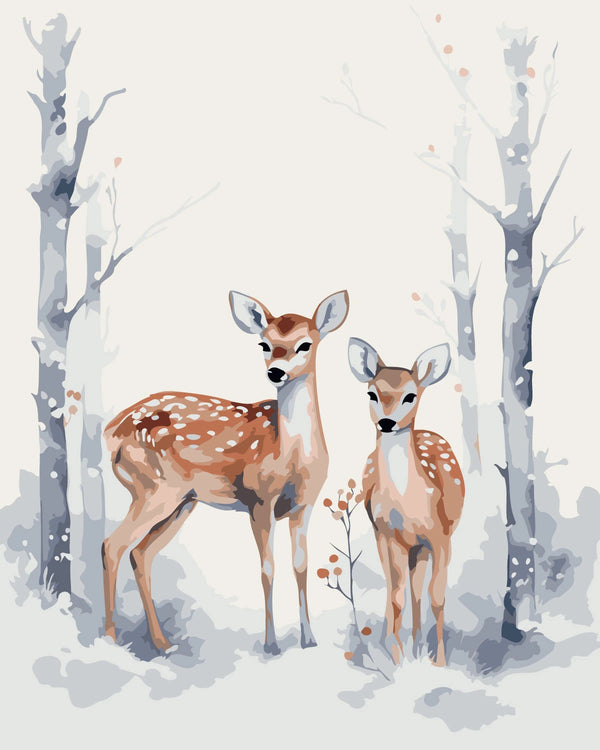 Two deer standing in a snowy winter forest with bare trees