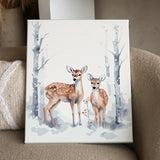 Two deer standing in a snowy winter forest with bare trees