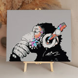 Colorful abstract chimpanzee wearing headphones in a contemplative pose
