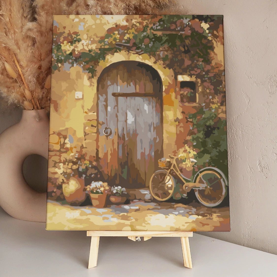 Rustic wooden door with vintage bicycle and potted flowers