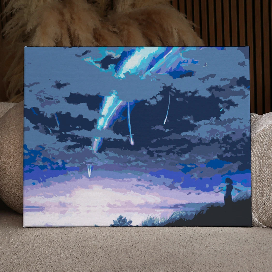 Meteor shower illuminating the night sky with a lone observer