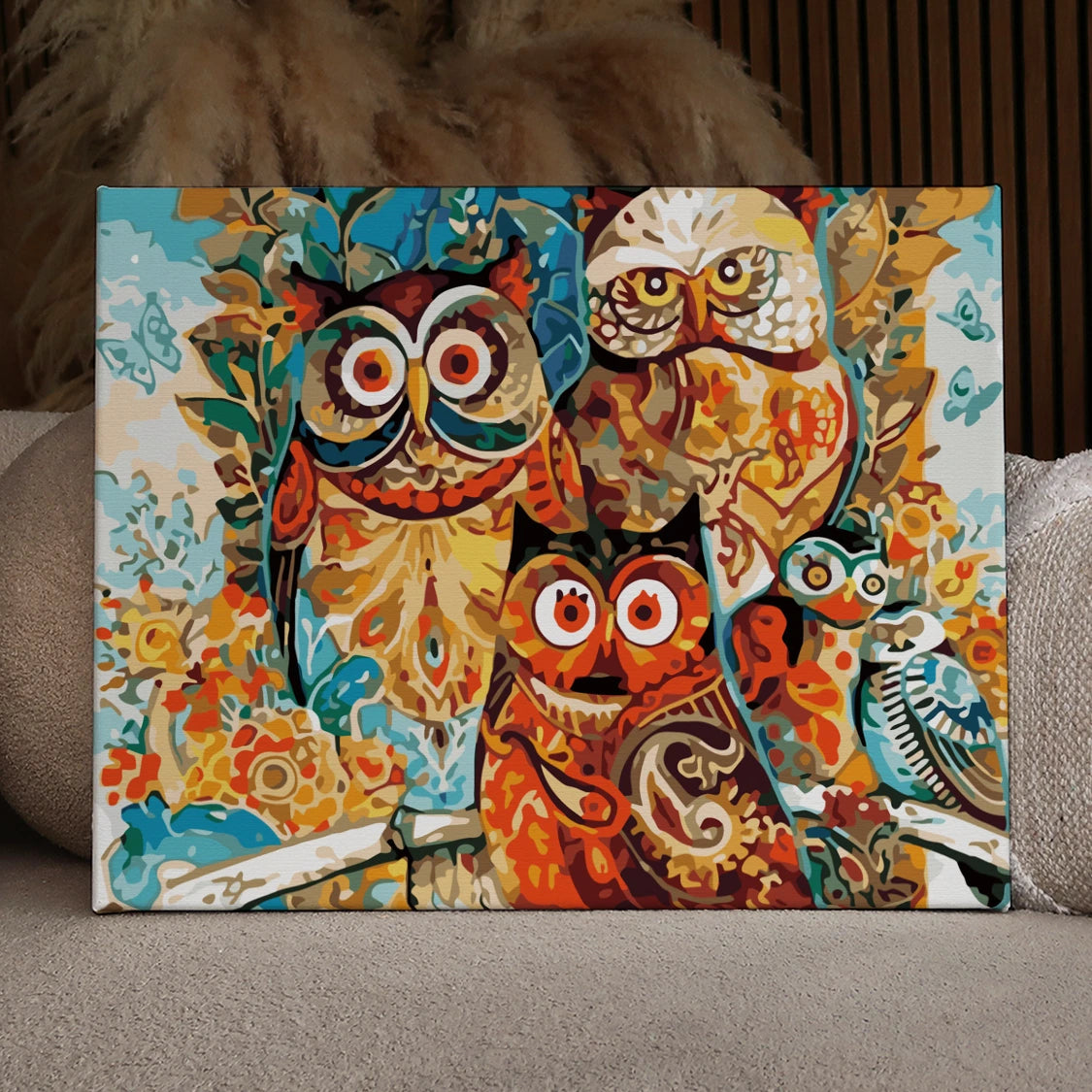 Colorful abstract painting of owls with intricate patterns and details