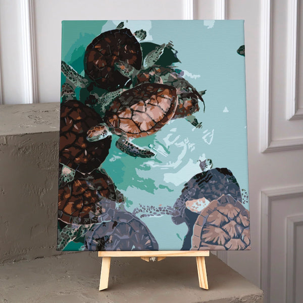 Sea turtles swimming in clear turquoise water with detailed shells