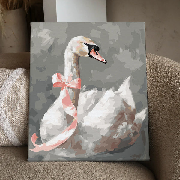 Elegant white swan with a pink ribbon on a gray background