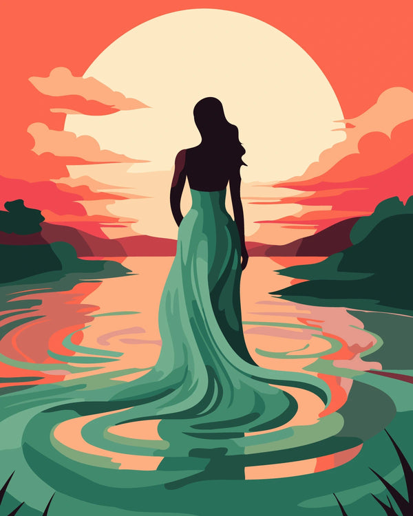 Silhouetted woman in flowing dress standing before a sunset lake