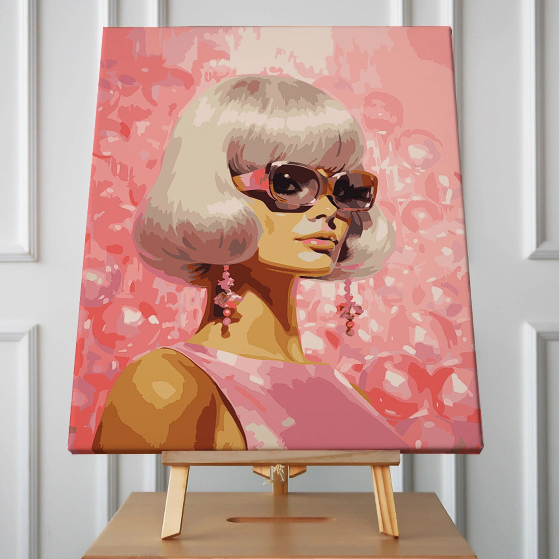 Stylish woman with blonde bob haircut wearing sunglasses and earrings