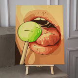 A close-up painting of lips licking a green lollipop.