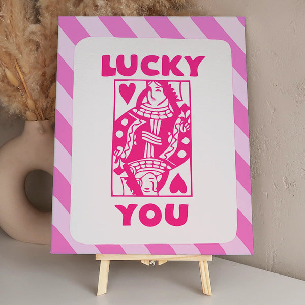 Pink queen of hearts playing card with "Lucky You" text