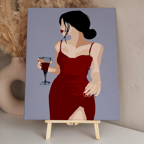 Elegant woman in red dress holding a glass of wine
