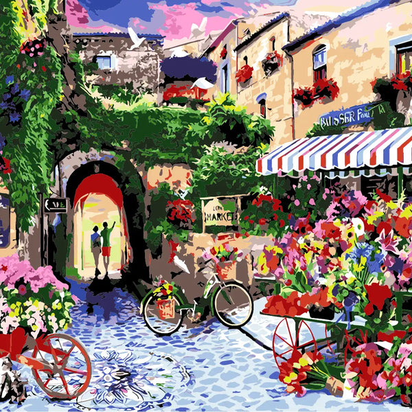 Colorful European street market with flowers, bicycles, and historic buildings