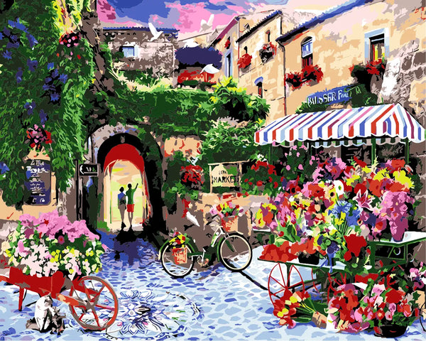 Colorful European street market with flowers, bicycles, and historic buildings