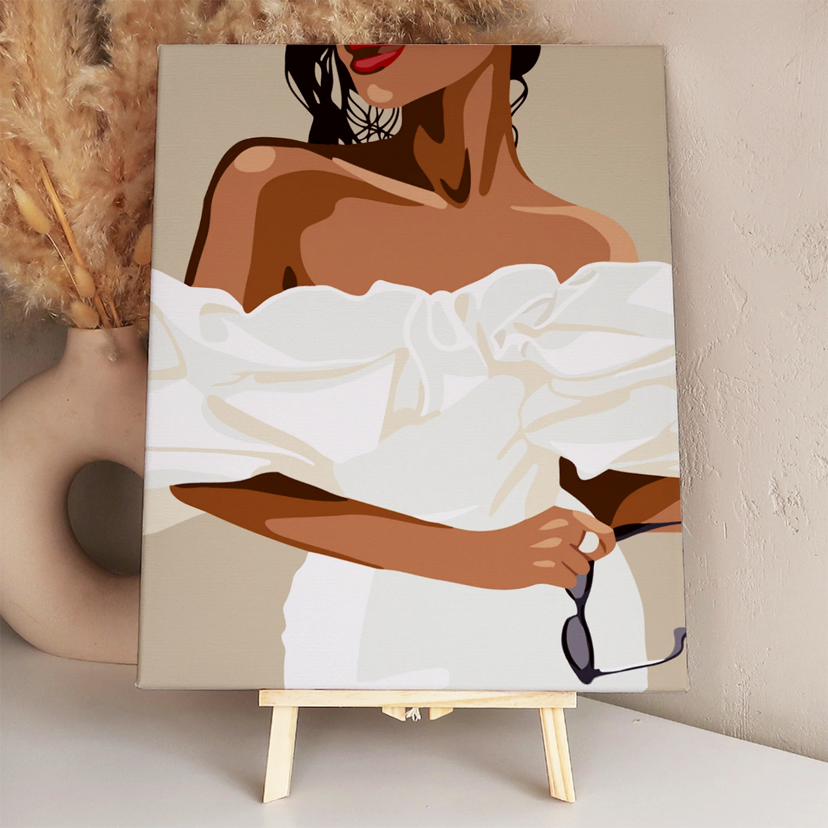 Elegant woman in white off-shoulder dress holding sunglasses