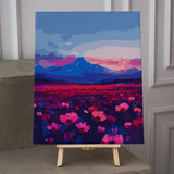 Colorful field of vibrant pink flowers with a mountain backdrop