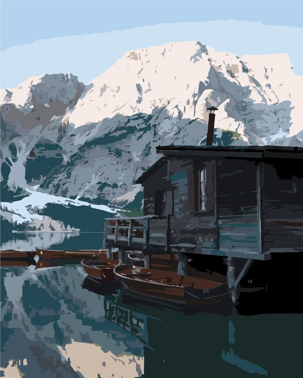 Rustic cabin by a mountain lake with wooden boats