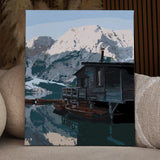 Rustic cabin by a mountain lake with wooden boats