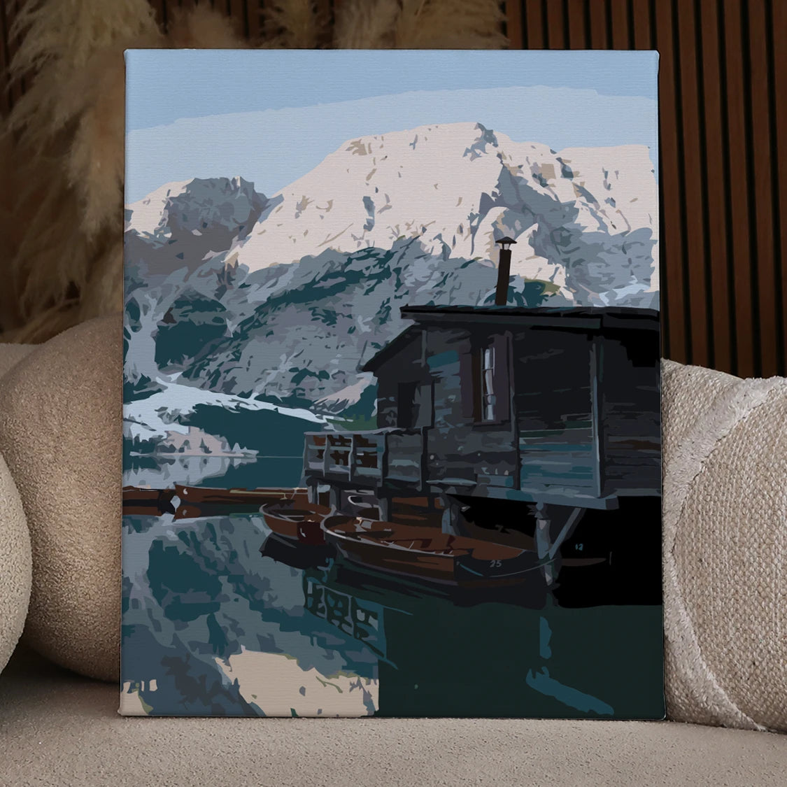 Rustic cabin by a mountain lake with wooden boats