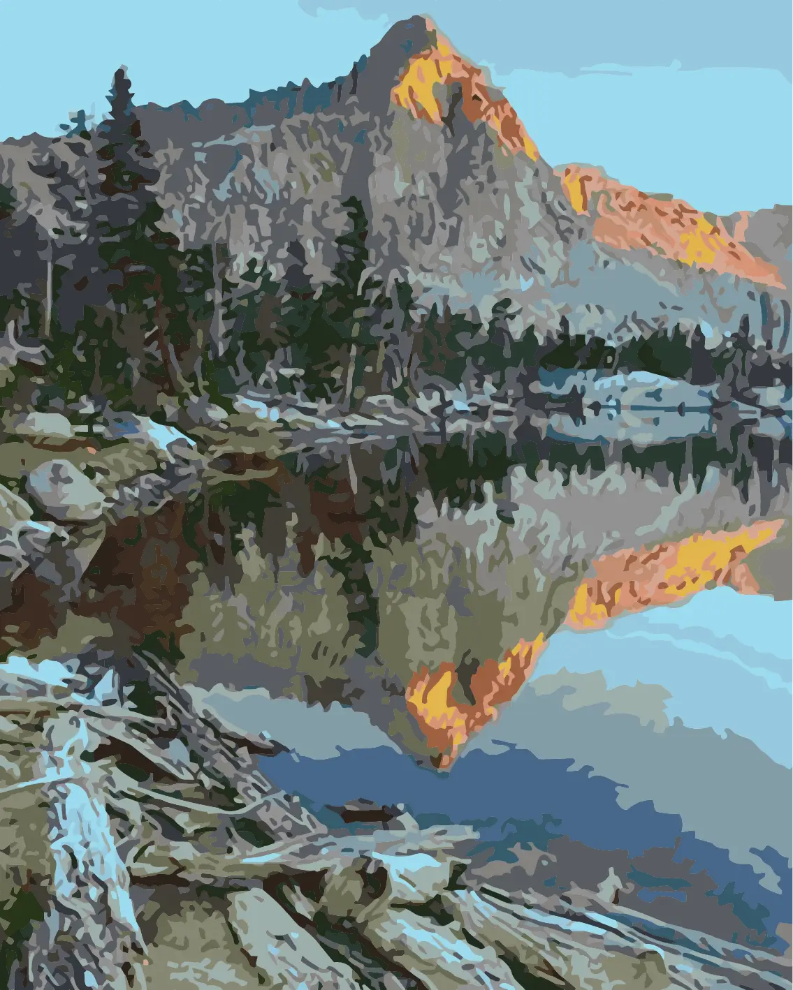 Mountain landscape reflecting in a calm lake at sunrise