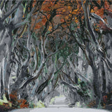 Enchanted tree tunnel with autumn leaves and a misty path