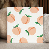 Seamless pattern of ripe peaches with green leaves on beige background
