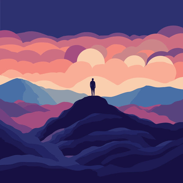 Silhouette of person standing on mountain peak under colorful sky