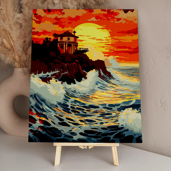 Dramatic ocean waves crashing against cliffs at sunset with house