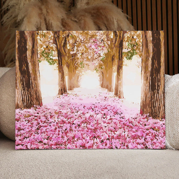 Tree-lined pathway with pink flower petals and soft sunlight painting