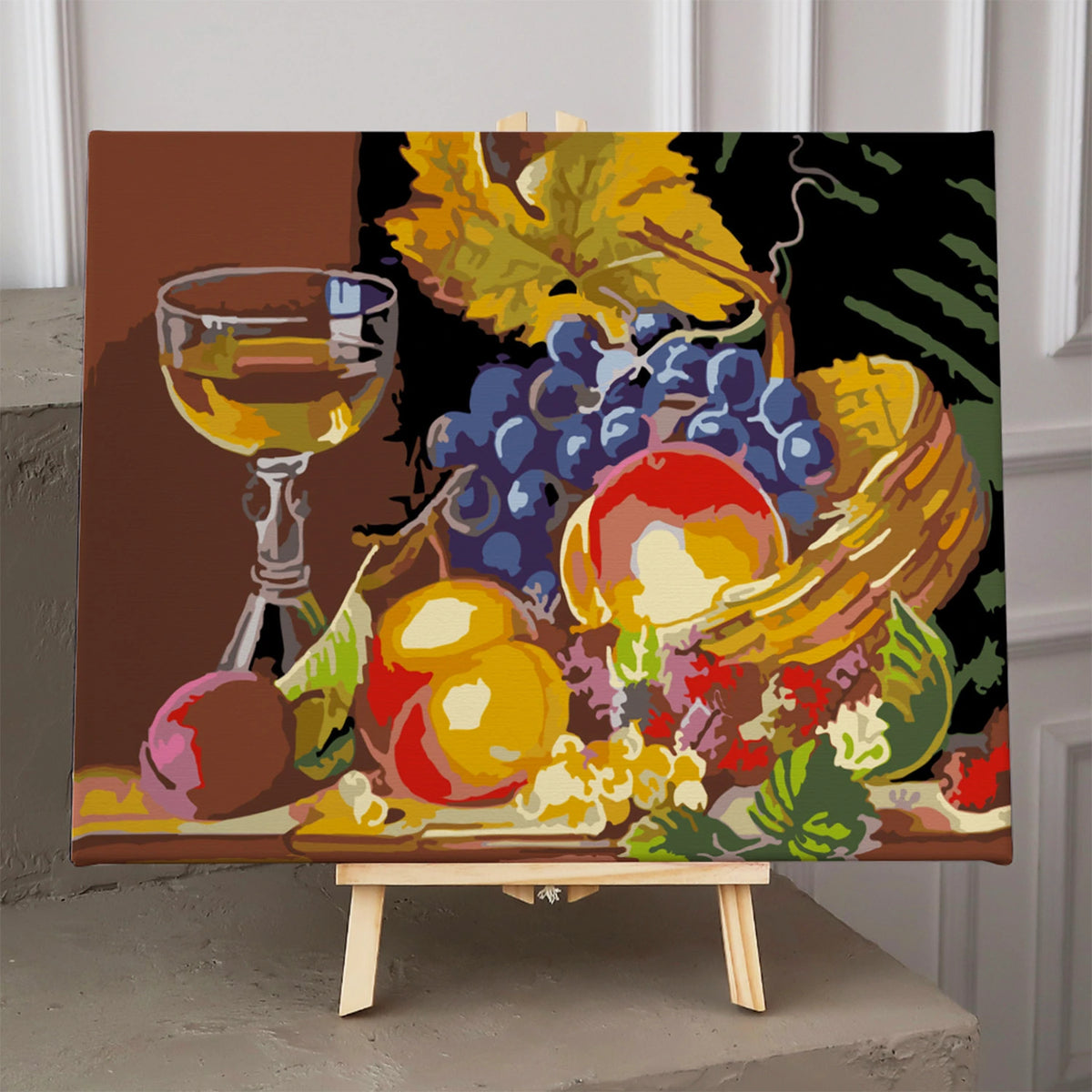 Still life painting with fruit basket, grapes, and wine glass
