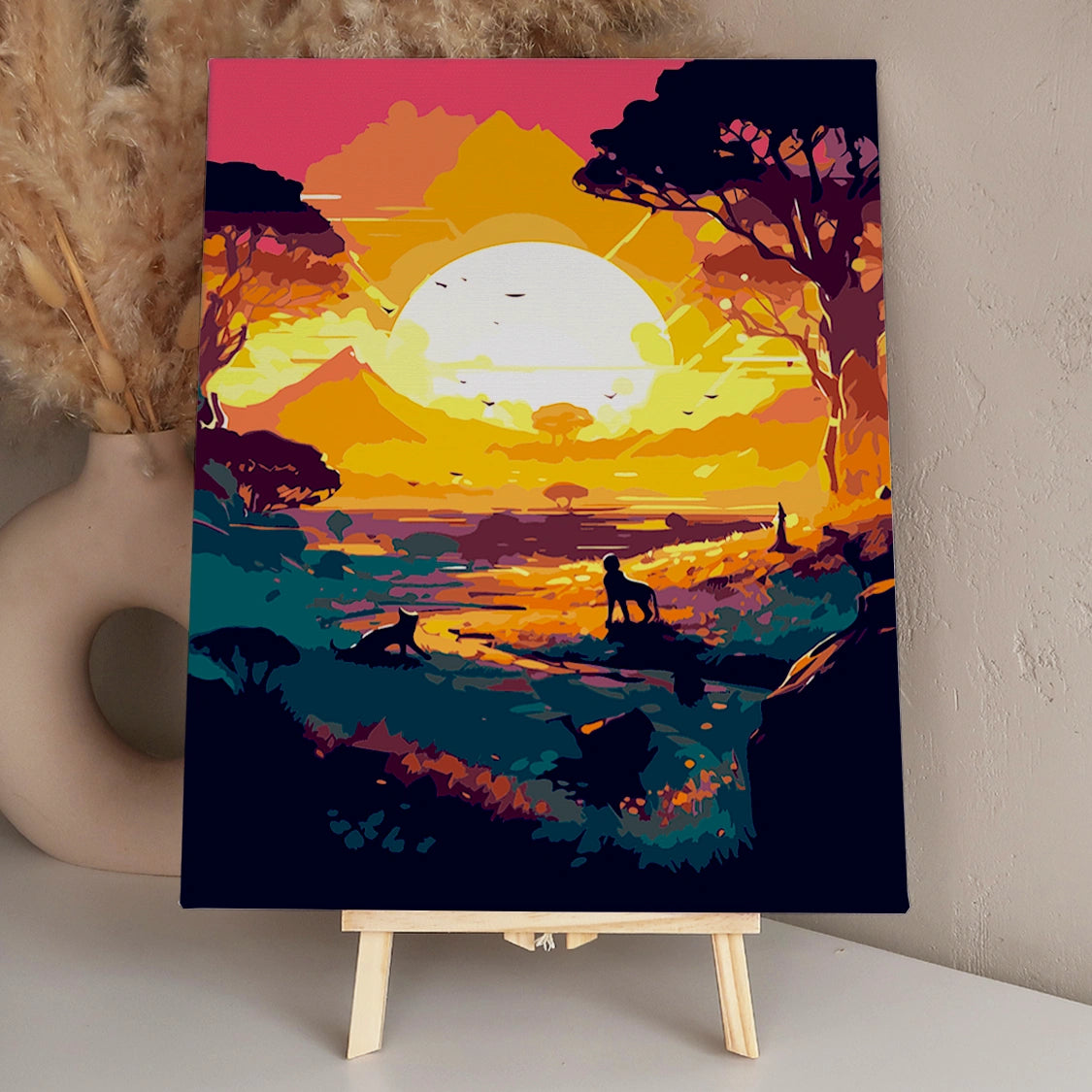 Vibrant African savanna sunset with silhouetted lions and trees