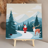 Santa Claus and reindeer in a snowy winter mountain landscape