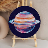 Colorful abstract painting of Saturn with vibrant rings in space