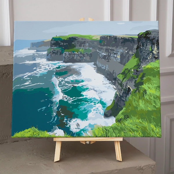 Cliffs overlooking the ocean with crashing waves and green hills painting