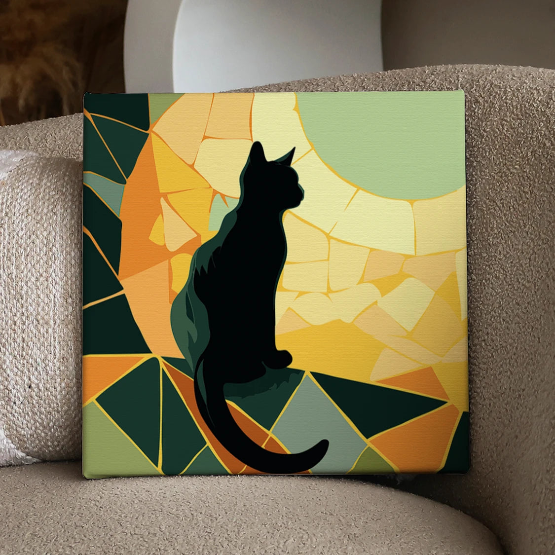 Silhouette of a black cat against a stained glass sunset