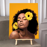 Portrait painting of a woman with afro, yellow flowers, and serene expression