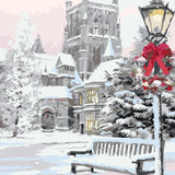 Snowy winter scene with castle, festive lamp post, and bench painting