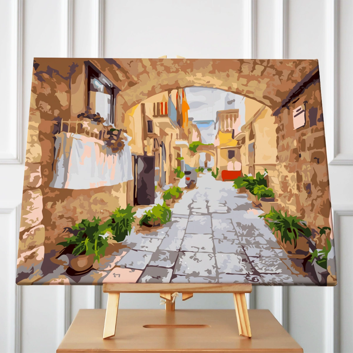 Painting of a charming Mediterranean alley with stone walls and plants