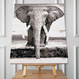 Stylized black and white painting of an elephant near water