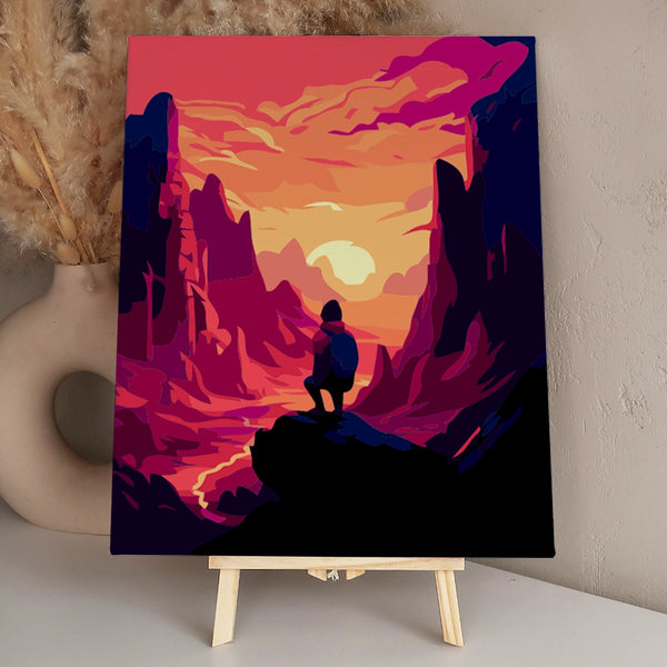 Hiker overlooking a dramatic canyon landscape at sunset painting