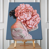 Surreal portrait of a woman with blooming pink roses head