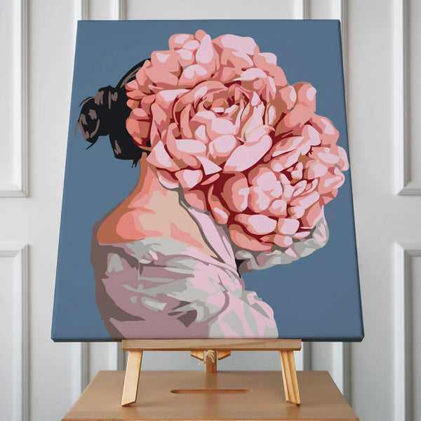 Surreal portrait of a woman with blooming pink roses head